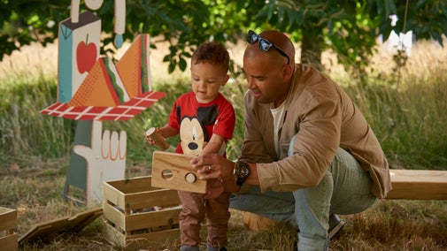A man and a child enjoying 'Summer of Play' activities at Polesden Lacey, Surrey